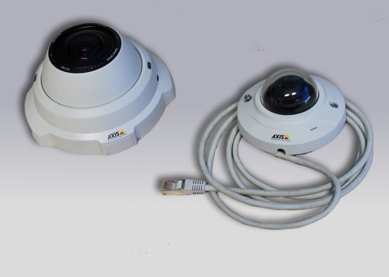 CCTV access control fit out Dubai - two Axis IP dome network cameras of the type specified for SIRA-compliant commercial surveillance in a UAE fit-out