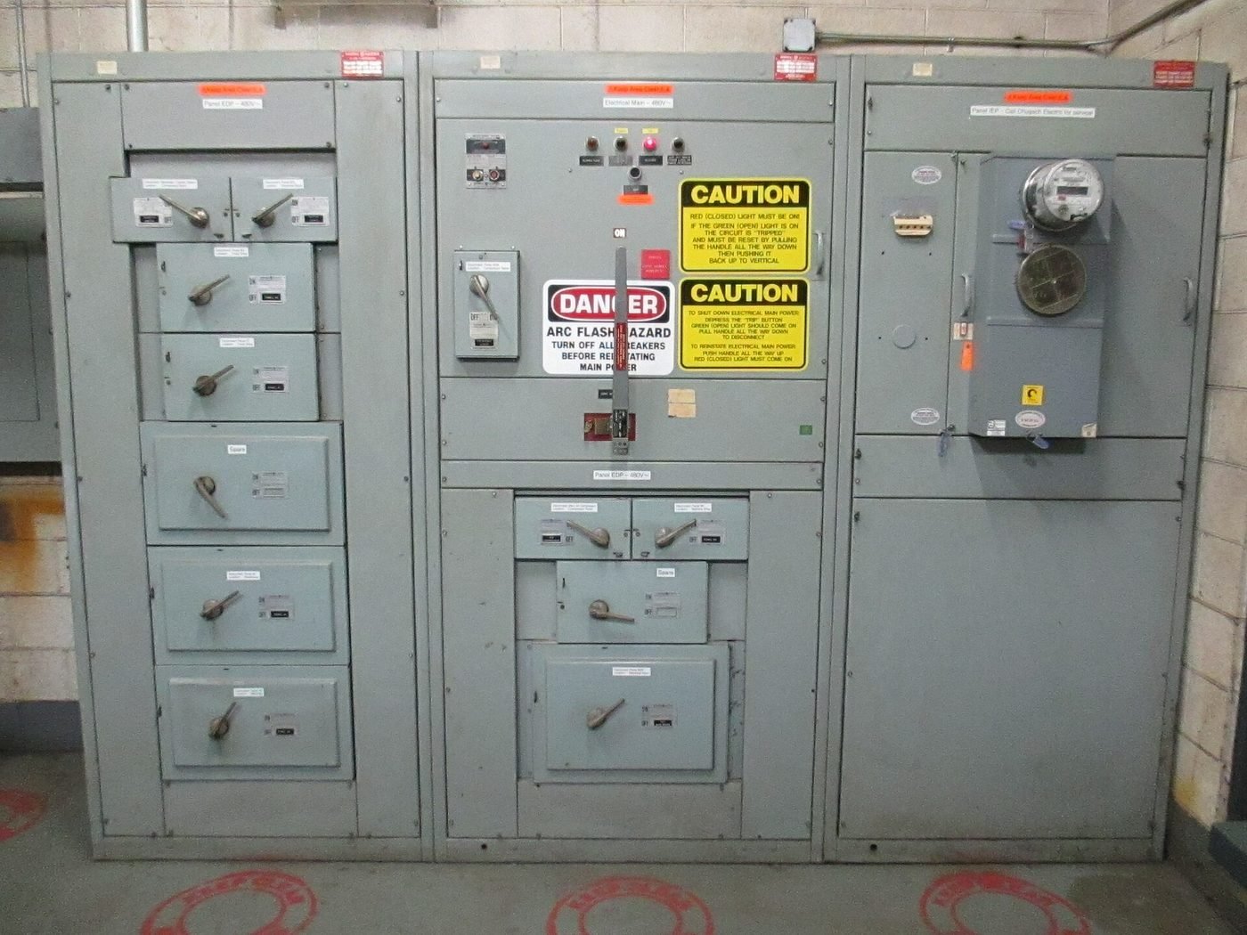 Main distribution panel and main switchgear in a commercial electrical room, showing the incoming main breaker, distribution board sections and outgoing circuit protection that a DEWA load upgrade replaces or re-rates