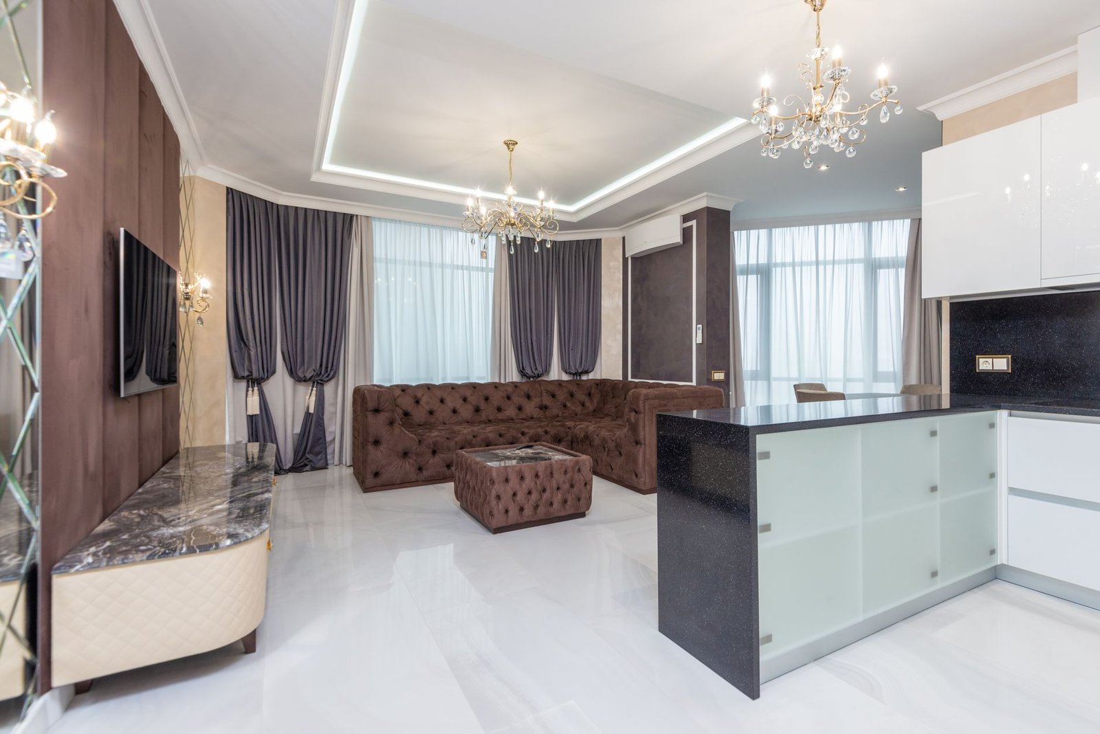 Modern interior ceiling design with elegant chandelier in a luxury Dubai apartment 2026