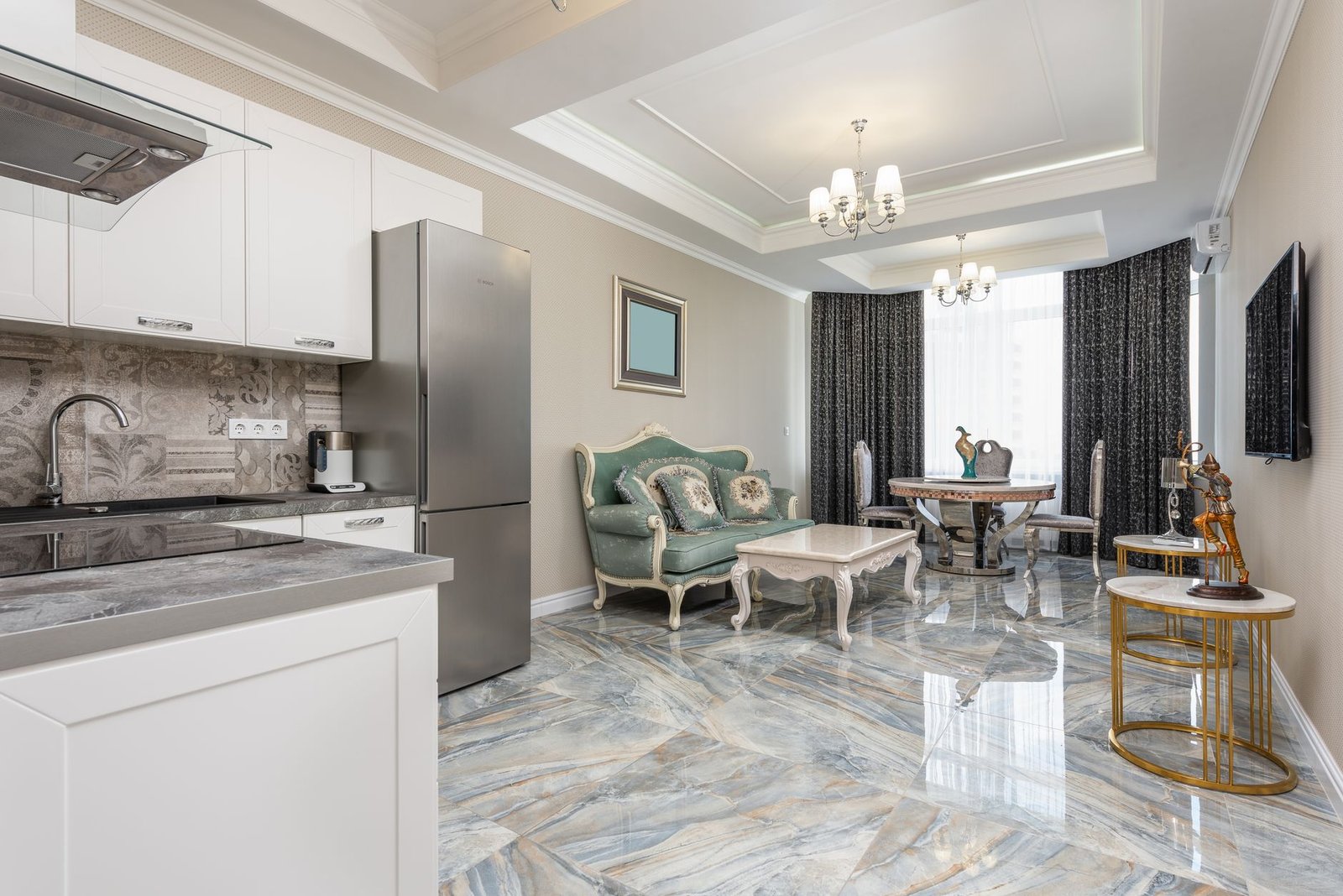 Luxury marble flooring in a contemporary Dubai residence 2026 — large-format polished stone with veining detail in open-plan living area