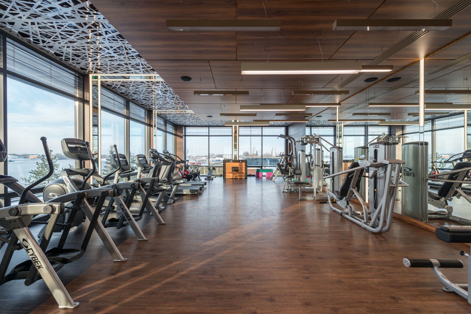 Modern commercial gym interior fit-out in UAE — open plan fitness centre with cardio equipment and premium flooring