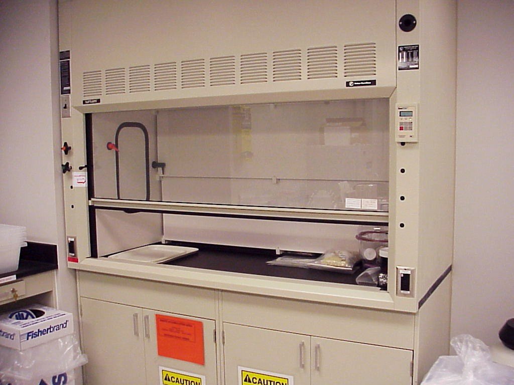 Laboratory fit-out Dubai - ducted laboratory fume hood with sash and worksurface, the equipment that sizes most of a lab's HVAC design