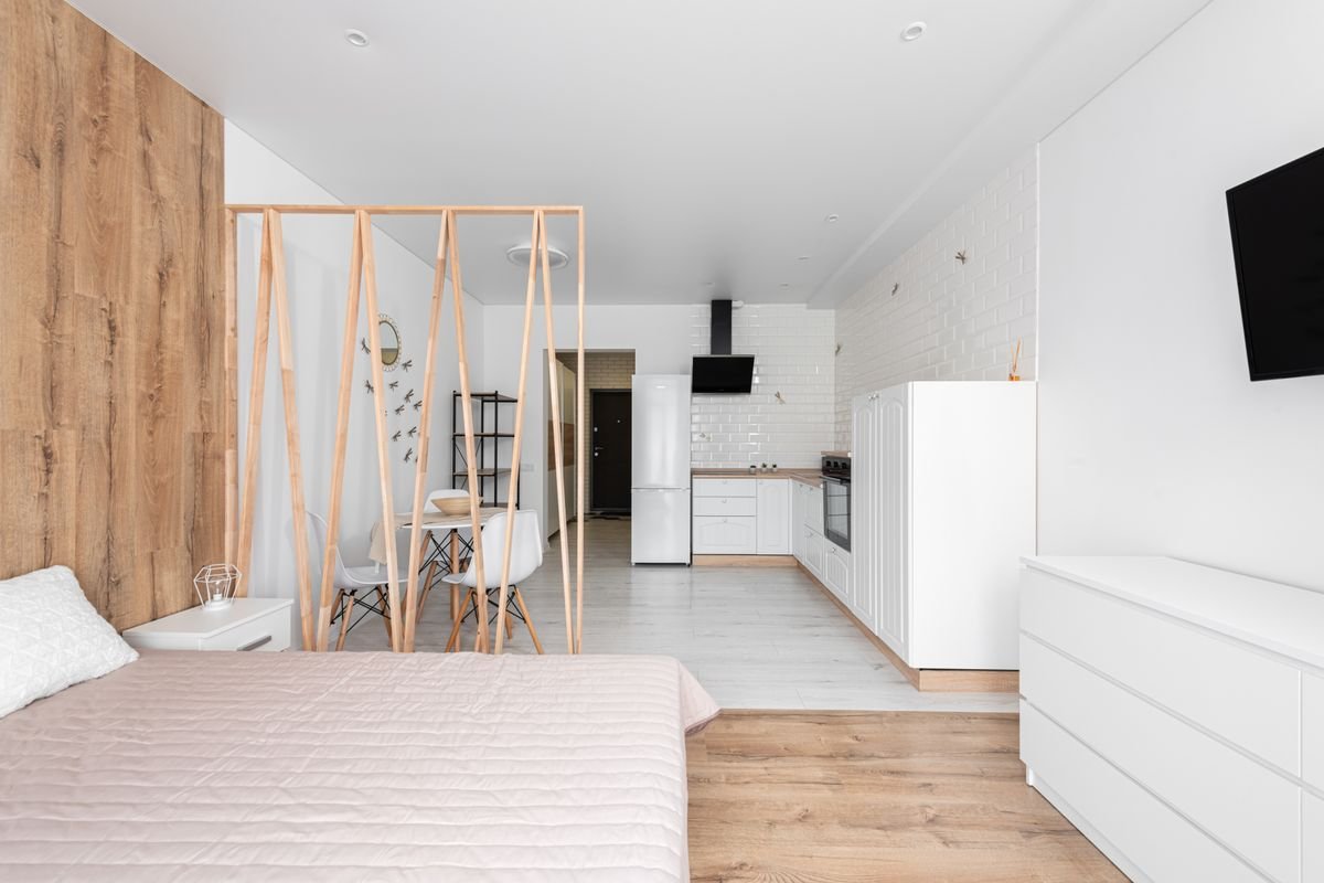 Modern studio apartment interior design Dubai 2026 — open-plan layout with smart storage and neutral tones