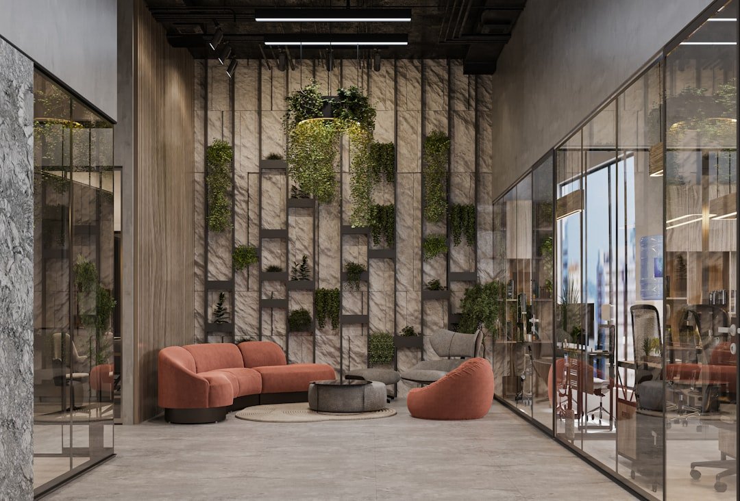 Sustainable office interior design Dubai 2026 — biophilic workspace with living plant wall and natural light