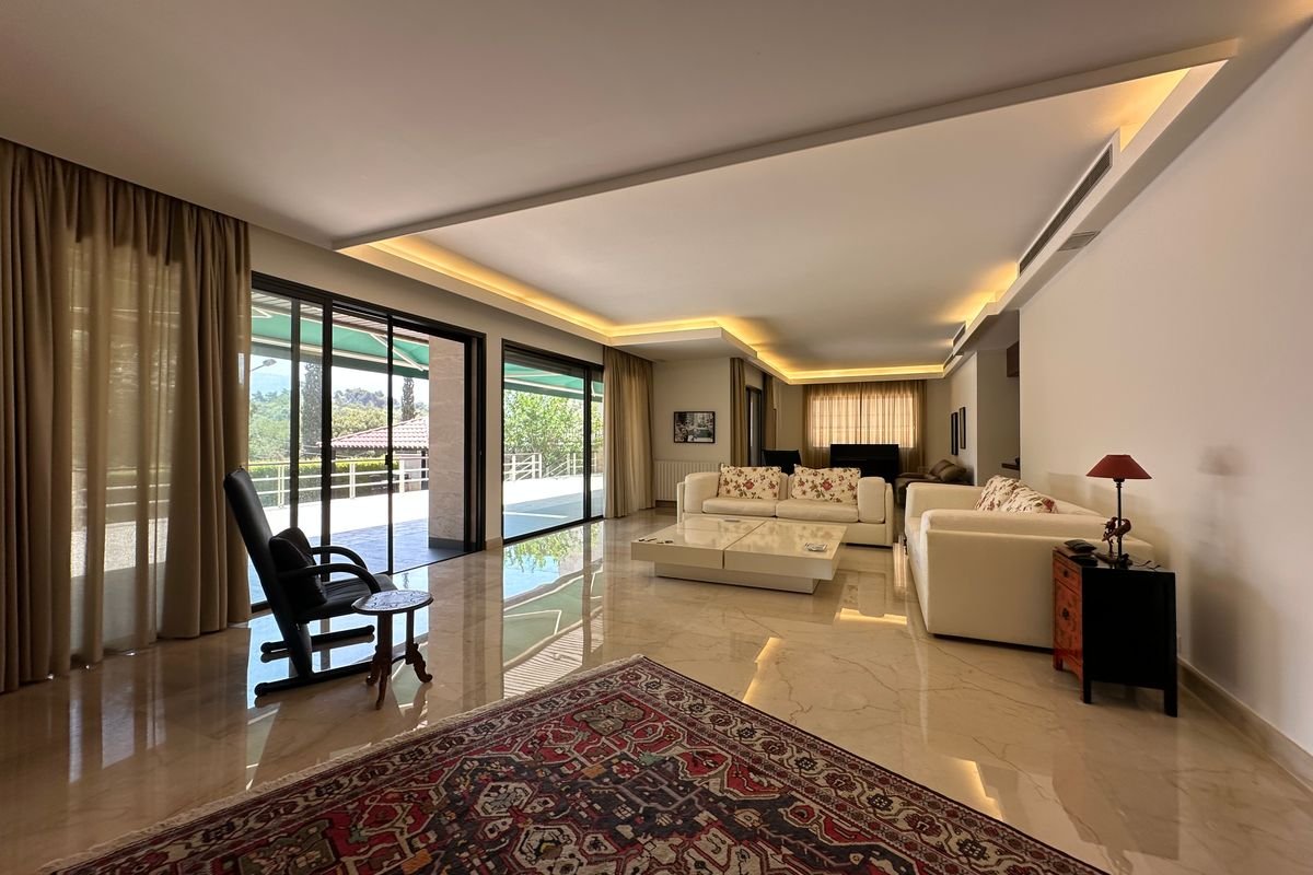 Luxury villa interior design in Dubai — living room with custom joinery and natural stone